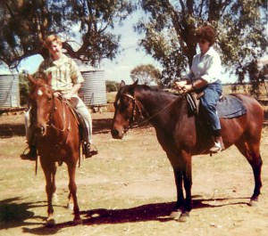 The artist on a chestnut gelding and her grandmother on a bay gelding on the family farm in 1985